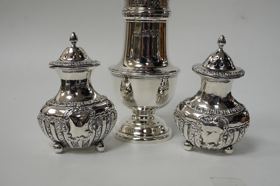 A George V silver sugar castor, by S. Blanckensee & Sons Ltd, Chester, 1929, 15.9cm and a pair of small late Victorian silver pepperettes, 8.4oz. Condition - poor to fair